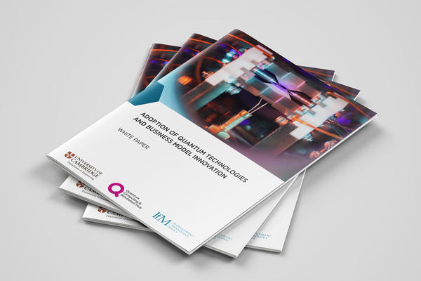 A pile of printed brochures on a plain surface